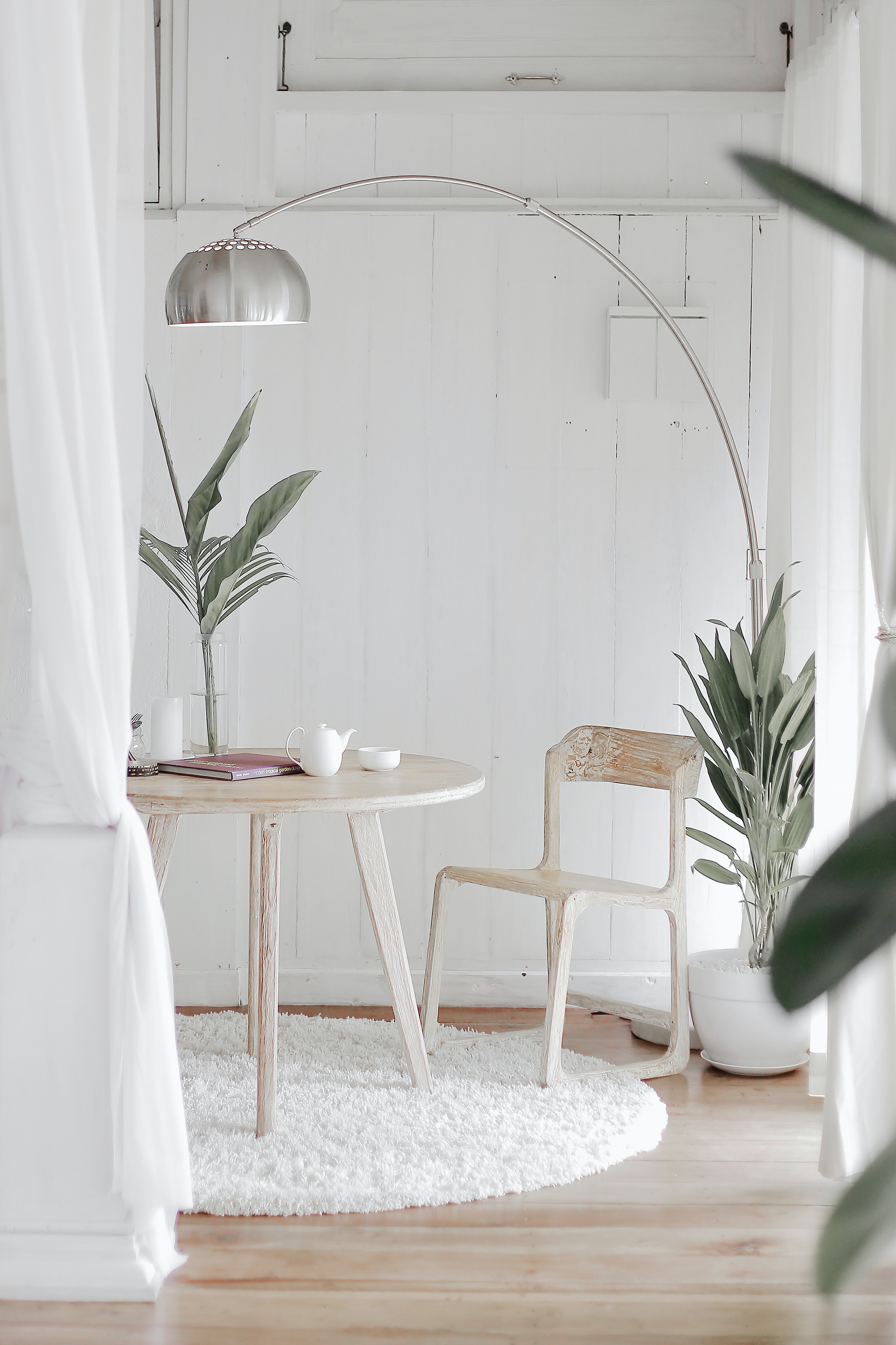 photo of a small round table with a chandelier